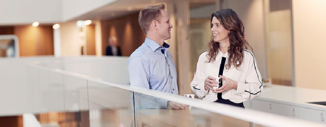 Account-management-Colleagues-talking-office-