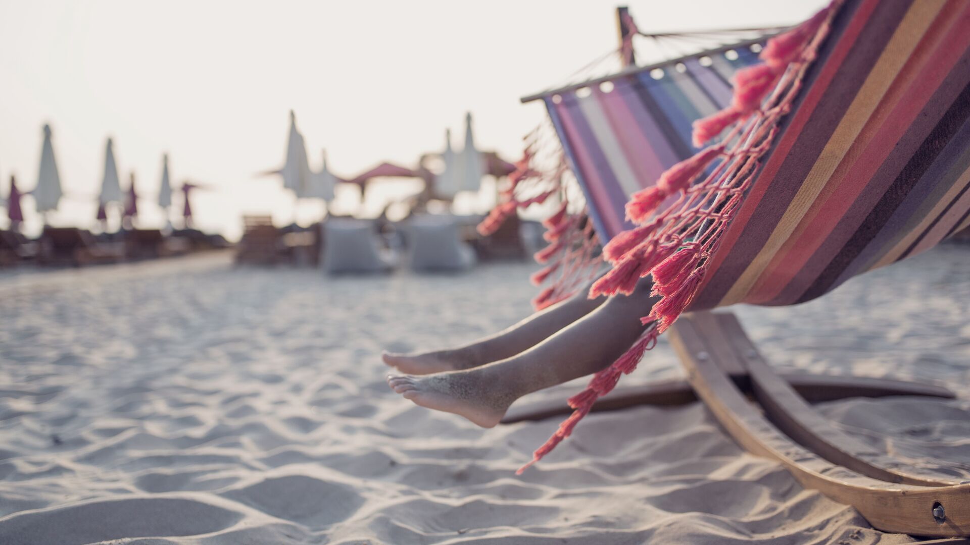 Child in hammock on a beach