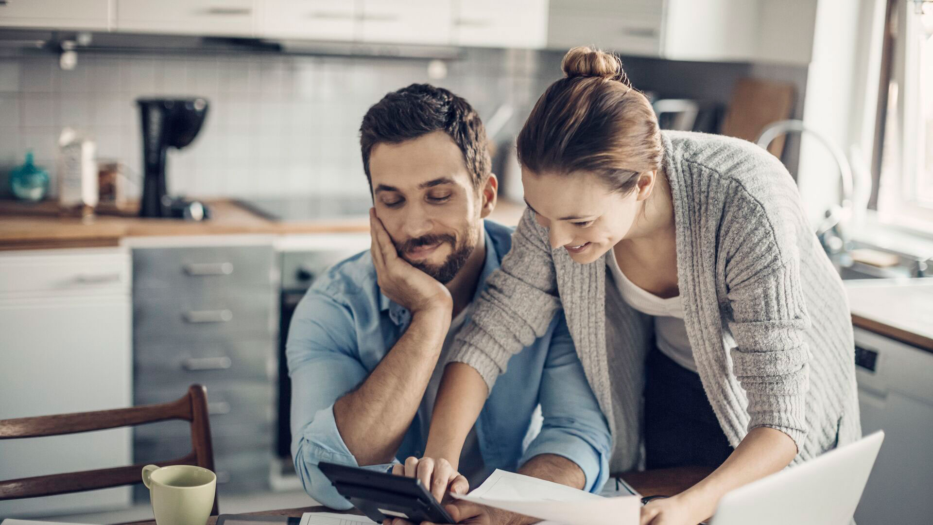 Young couple calculating home finances