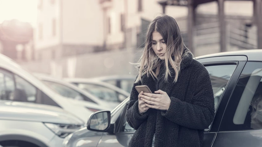 A woman checking her cell phone