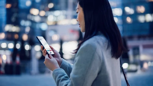 Businesswoman checking financial stock market