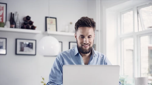 Happy man at laptop