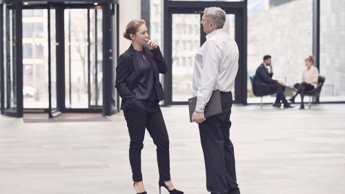 Business woman and man talking in entre