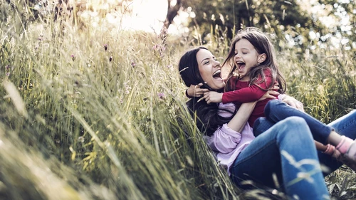 happy mother and child in a field