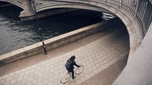 Woman on bicycle in city 