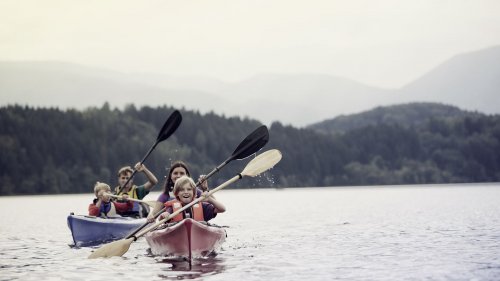 Family canoeing on lake