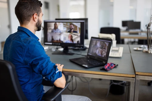 businessman-video-conferencing-with-team