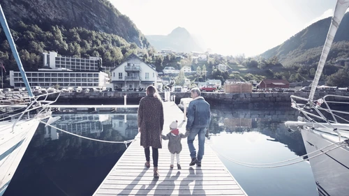 Family walking on pier