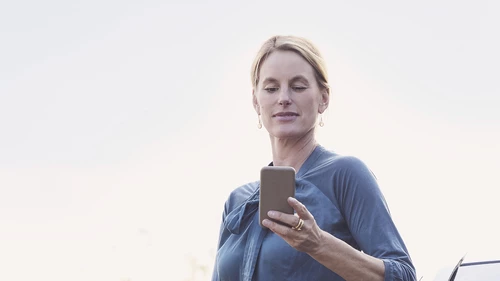 women looking at mobile phone