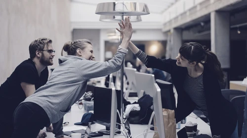 Happy programmers giving a high five