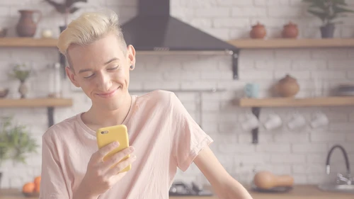 boy looking at phone - RESTRICTED USE