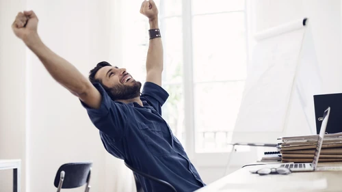 Businessman stretching at desk