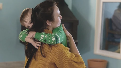 Mom and son hugging 