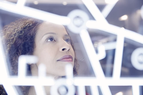 Woman operating digital interface technology