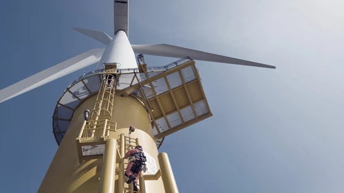 Man climbing on windmill