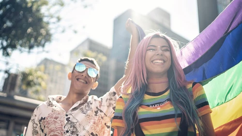 Two friends enjoying Pride parade