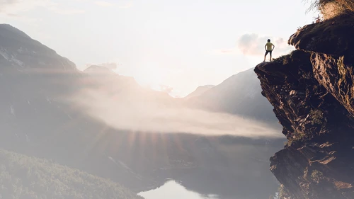 success-man-standing-on-mountai