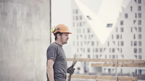 crafts-man-with-helmet-on-building-site.jpg
