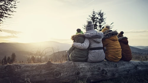 family sitting outdoors winter