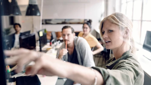 Woman showing something on a screen