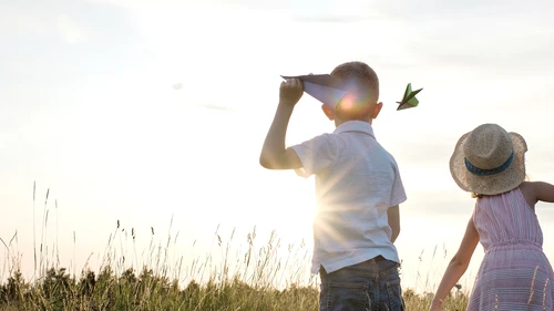 kids playing in a field in summer 