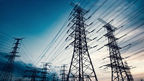 High voltage towers in the dusk of the evening