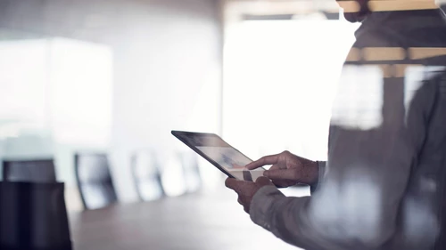 Businessman using tablet in conference room