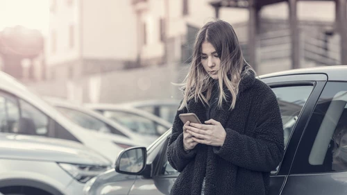 A woman checking her cell phone