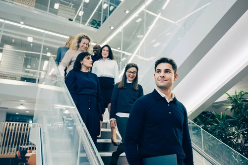 Group of people walking down the stairs