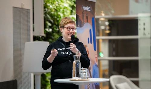 Women giving a speech at the event
