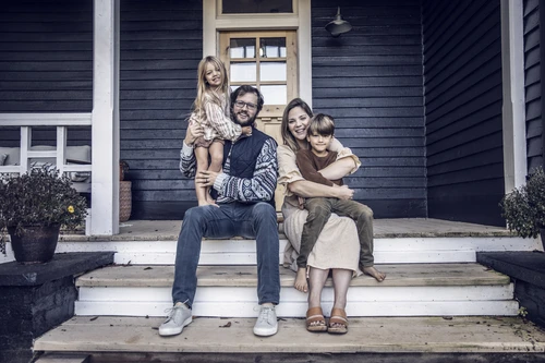 happy family sitting on the porch