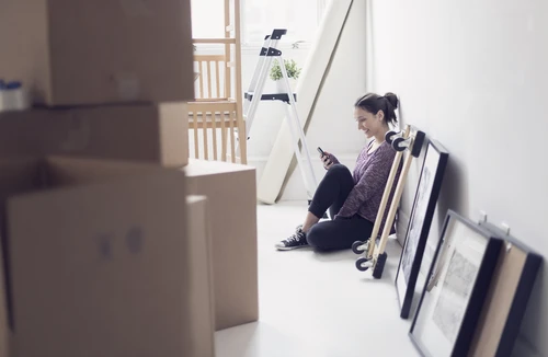 Young woman moving into new apartment