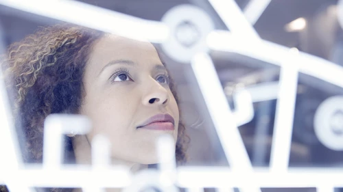 Woman operating digital interface technology
