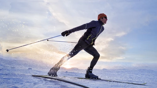 man skiing fast