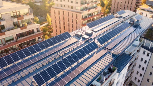 Solar panels on the roof of an apartment building in Stockholm, Sweden