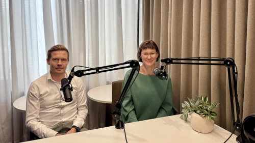 Juho Kostiainen and Tuuli Koivu in a podcast studio