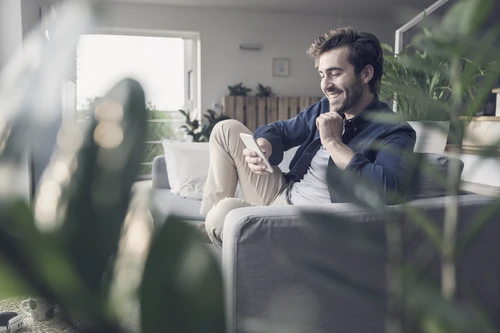 young-man-sitting-on-couch
