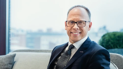 Frank Vang-Jensen sits in a couch with a view behind