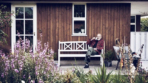 Retired man in summer house