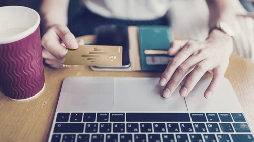 Woman shopping online with credit card