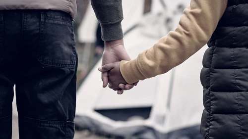 Holding hand of child