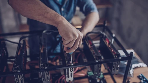 guy-configures-the-computer-for-mining-cryptocurrency