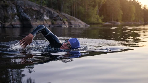 sports-person-swimming-with-heads-out-of-the-water-on-lake