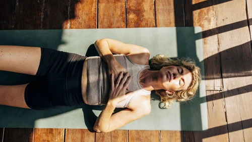 Woman on exercise mat