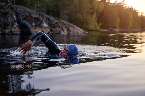 sports-person-swimming-with-heads-out-of-the-water-on-lake-