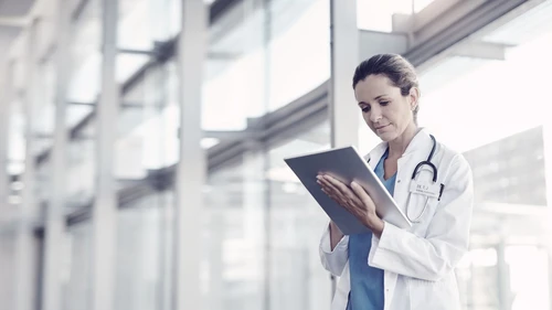 A female doctor using a digital tablet