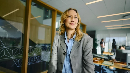 business-woman-standing-optimistic-at-a-business-office 