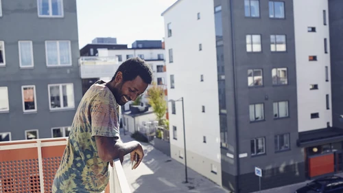 Man standing on a balcony in Sweden, Stockholm, Annedal