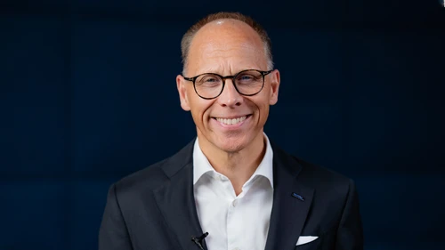 Frank Vang-Jensen on dark background