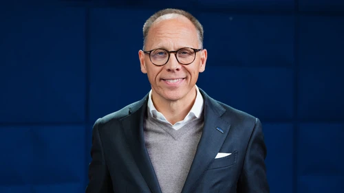 Frank Vang-Jensen on blue background